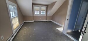 Empty Room with paint-splattered floor.
